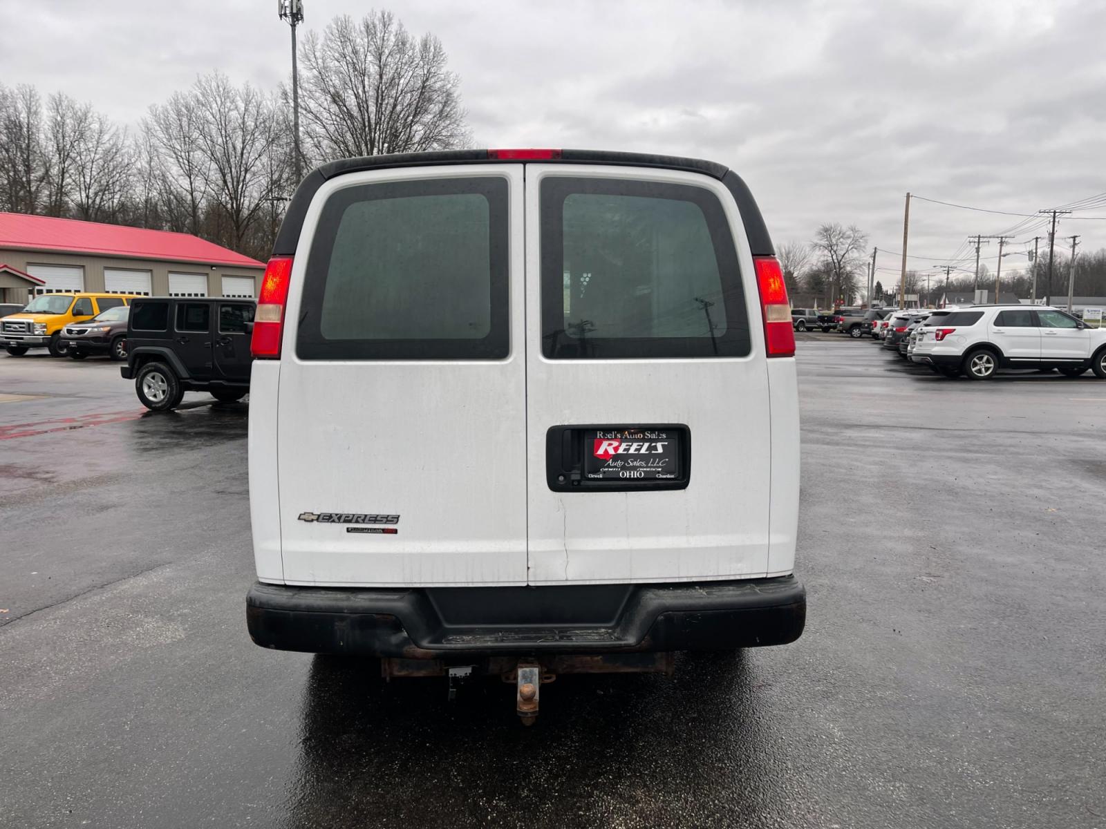 2014 White /Neutral Chevrolet Express 1500 AWD Cargo (1GCSHAF4XE1) with an 5.3L V8 OHV 16V FFV engine, 4-Speed Automatic transmission, located at 547 E. Main St., Orwell, OH, 44076, (440) 437-5893, 41.535435, -80.847855 - This 2014 Chevrolet Express 1500 Cargo Van with a 5.3L Vortec V8 engine and all-wheel drive is a versatile and robust vehicle designed to meet various transportation and towing needs. It comes equipped with convenient features such as power windows, power locks, and a backup camera for safer reversi - Photo #8